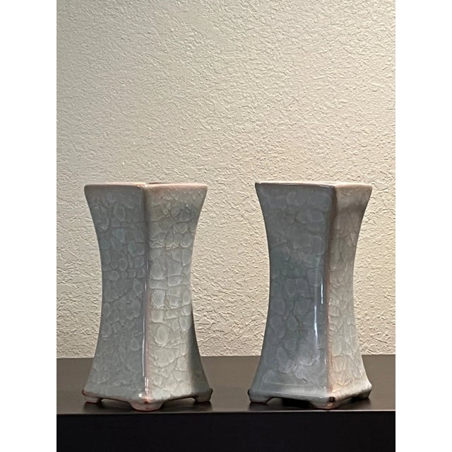 This handsome 3-piece set of Chinese porcelain features a matching celadon crackle glaze execution in the classical Ge and...