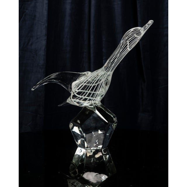 Hand-blown artistic glass bird sculpture made in Murano by Zanetti, Italy, circa 1970s. The body is crafted from clear...