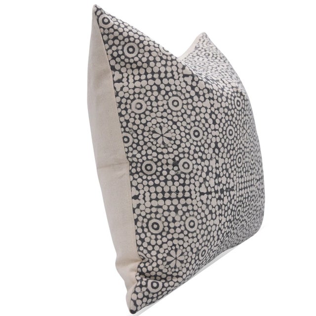 The Chunributi cushion cover draws inspiration from traditional Rajasthani chunri patterns, featuring a charming hand...