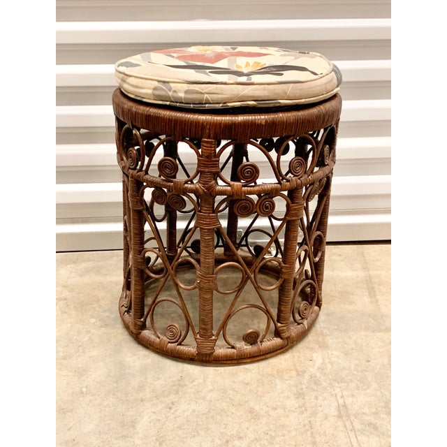 Vintage wicker stool. Has upholstered cushion that comes with it. Cushion is 1.25”h and features a floral design. Perfect...