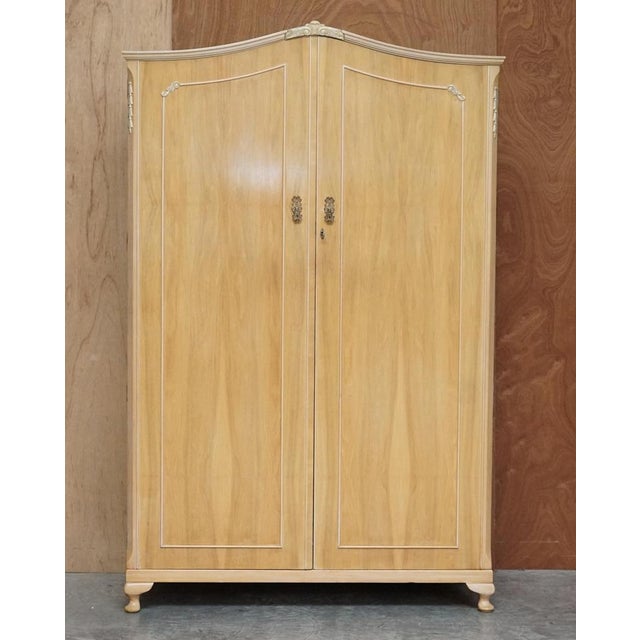 We are delighted to offer lovely circa 1940s light walnut double wardrobe made by the walnut cabinet works which is part...