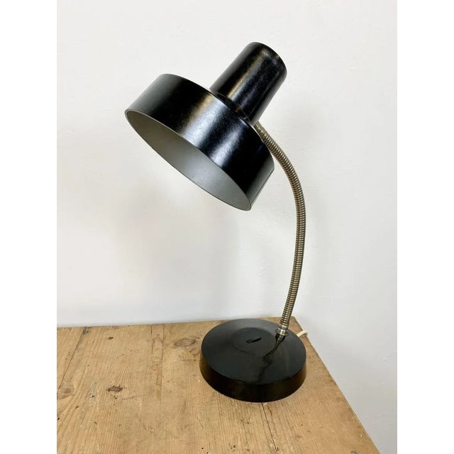 Vintage industrial bakelite adjustable desk lamp made by Elektrosvit in former Czechoslovakia during the 1960s. It...