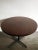 Italian table with dark wood veneered top circular and metal structure with adjustable feet in brass, Italy 1950s