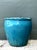 With its robust rounded form and vibrant blue glaze, this vintage ceramic planter brings a rustic yet refined presence to...