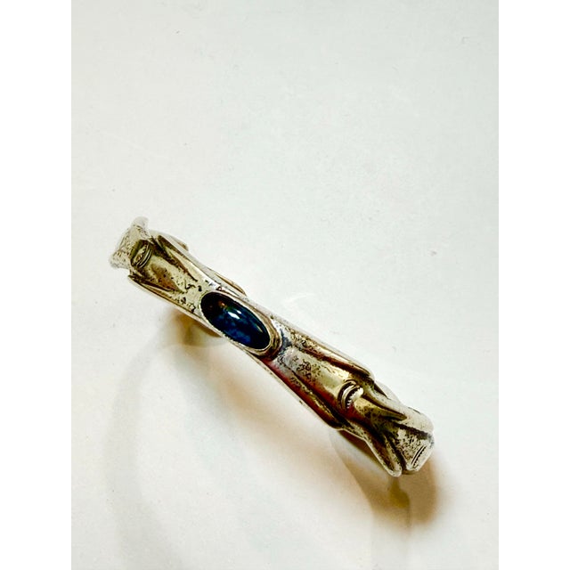A gorgeous vintage Native American style silver cuff bracelet. This substantial piece features a single, stunning oval...