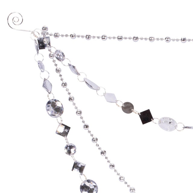 Elevate your holiday decor with the Jewel Bead and Chain Link Garland. Measuring 20 inches in length, this glamorous...