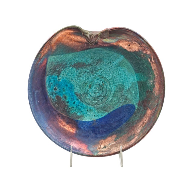 Low, wide studio ceramic bowl by Palo Alto artist Joy Imai, distinguished by an iridescent copper and turquoise glaze that...