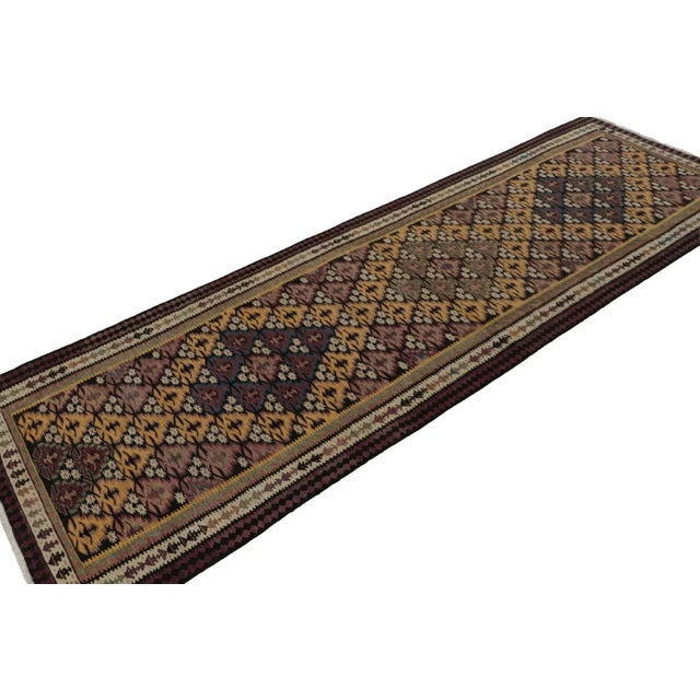 This vintage 3x10 Persian Kilim runner is the latest to join Rug & Kilim’s selection of vintage flatweaves. On the Design:...