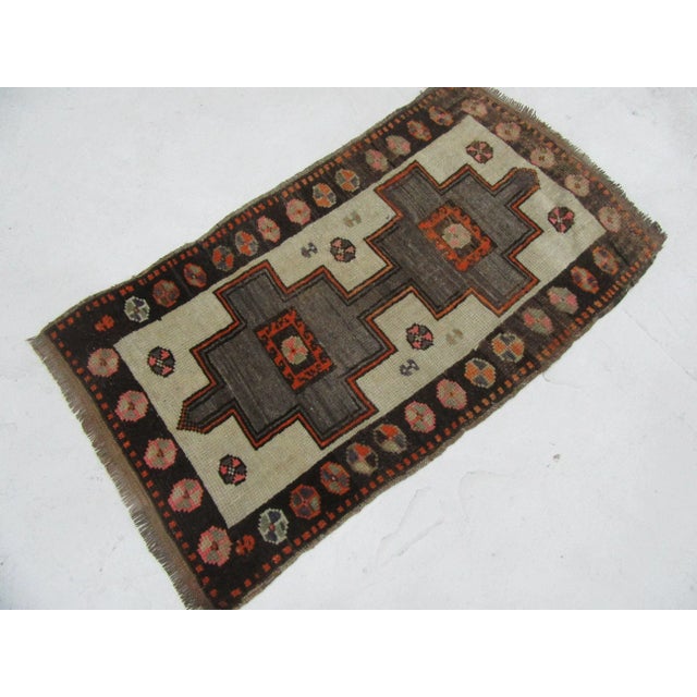 Vintage Handknotted decorative mini rug from Kars region of Turkey. Approximately 45-55 years old. In very good condition.
