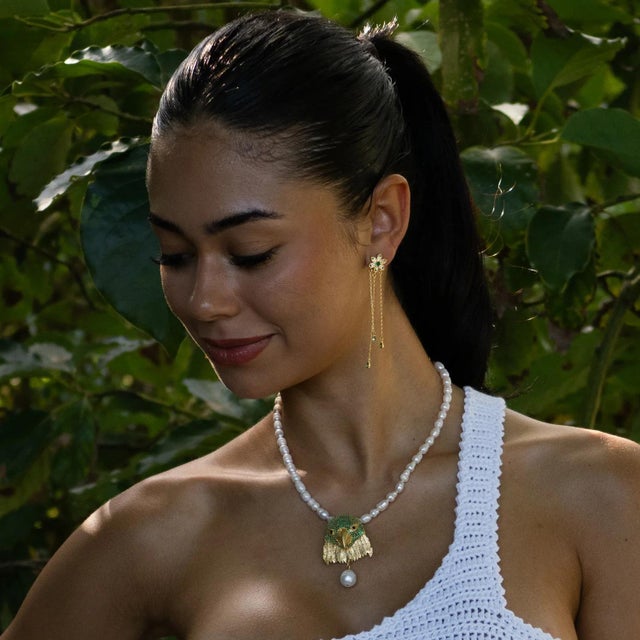 Bring a touch of elegance and natural energy to your style with the Blossom Glow Emerald Drop Earrings. Crafted in 18k...