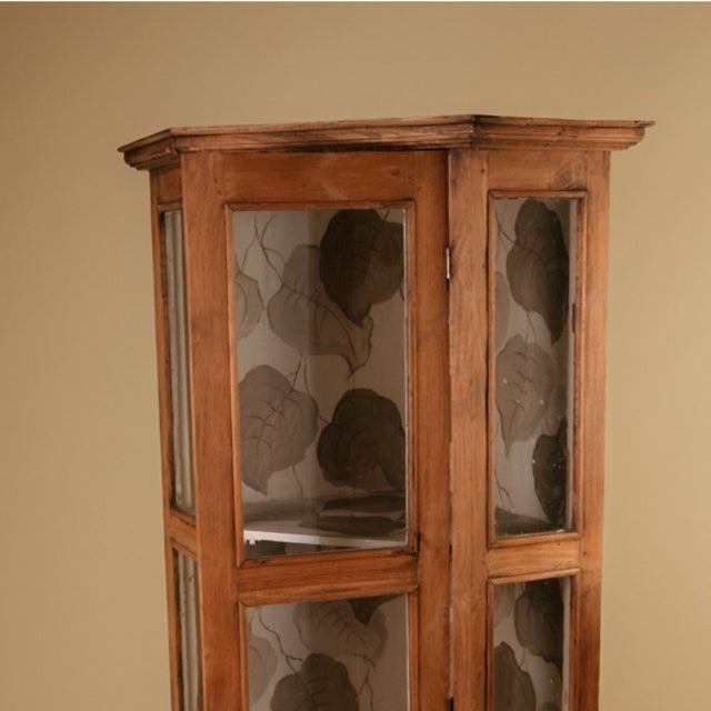 Corner cupboard with a hexagonal profile. Made in the late 19th or early 20th century from exceptionally light and...