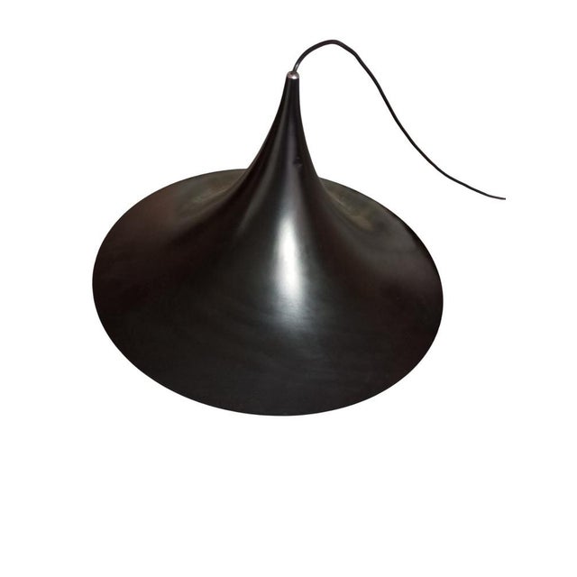 The "SEMI" pendant lamp was designed by Claus Bonderup and Torsten Thorup for the renowned company Fog & Morup in the...