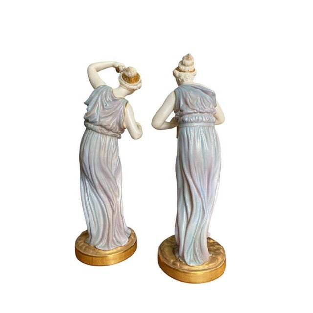 A superb and highly decorative pair of Royal Worcester porcelain figures, modelled by the celebrated sculptor James Hadley...