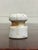 This is an antique small white ceramic or porcelain insulator that would have originally been for electrical wires for...