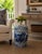 A classic blue and white porcelain garden stool, decorated with traditional Chinese scenes and motifs and stylized floral...