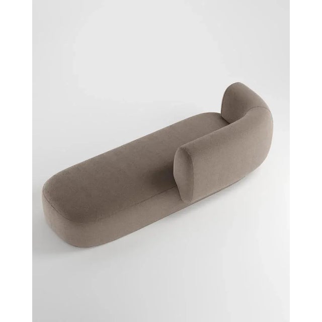 Hug sofa is defined by clean, simple lines and a distinctive armrest detail. The armrest, half overlapping the seat...