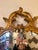 Lovely medium sized oval giltwood mirror having French curlicue style. GG Details Dimensions Height: 45 in (114.3 cm)...