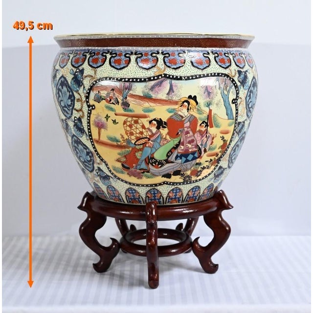 Large enameled polychrome china porcelain aquarium. It is decorated with traditional Chinese cartridge scenes on the...