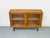 A high-quality display cabinet crafted from oiled oak with a warm, natural look. The two sliding doors feature solid wood...