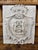 A beautifully aged Italian stone plaque featuring the Cambiaso family coat of arms, carved in elegant relief with a...