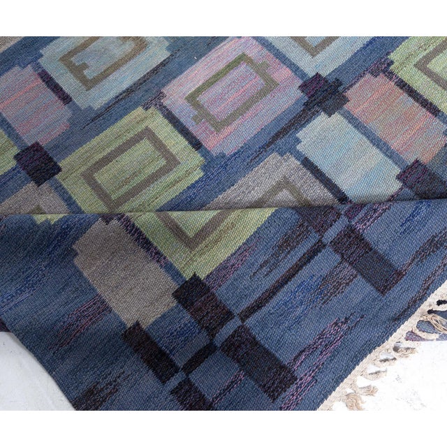 The Vintage Swedish Flat-Weave Rug known as "Spise Hall," designed by the esteemed Judith Johansson, is a remarkable...