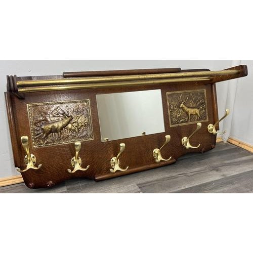 This impressive Vintage French coat hanger combines a practical wall-mounted design with decorative brass relief panels...