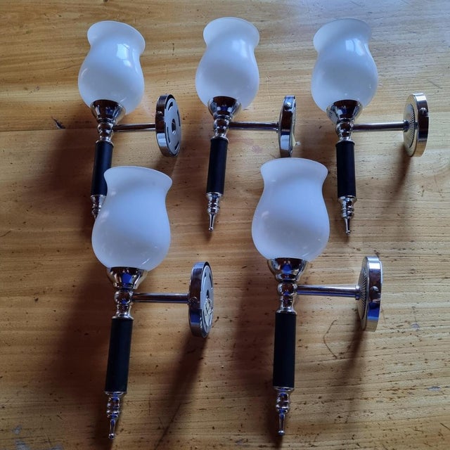 Set of 5 'torch wall sconces attributed to Jacques Adnet 1950. Opaline torches (2 opalines with small impact: see photos)....