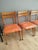 Set of 4 chairs from the 1960s made of solid beech wood, restored and treated. New upholstery in orange.