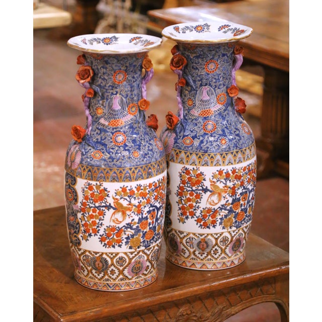 Bring vibrant color and refined craftsmanship to your interior with this elegant pair of antique porcelain vases crafted...