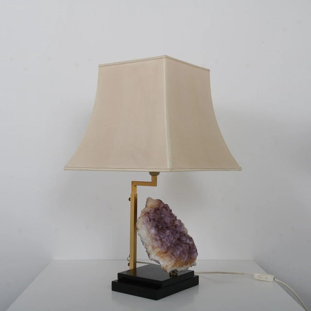 A rare table lamp with beautiful large Amethyst core, in the style of Willy Daro, manufactured in Belgium around 1970. The...