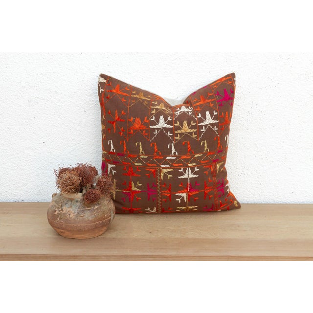 This 18-inch square pillow is a luminous masterpiece of Antique Phulkari craftsmanship, repurposed from a rare 19th-...