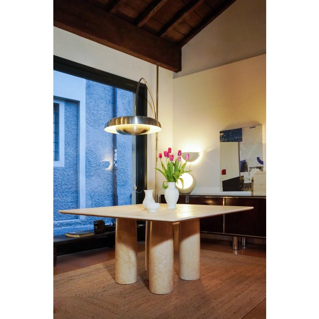 Colonnato dining table by Mario Bellini for Cassina, in travertine with a base composed of 5 columns and a 3.5 cm thick...