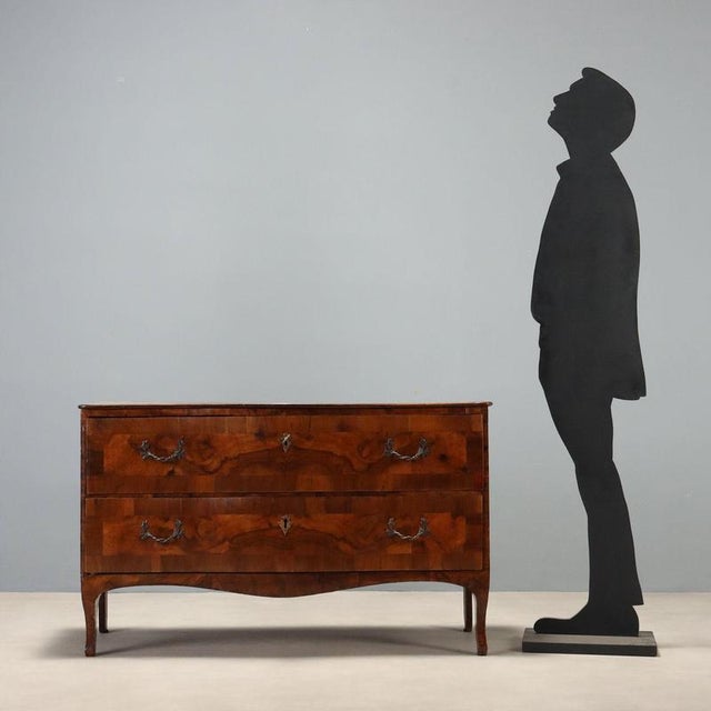 Mid-18th century Lombard-Venetian Barocchetto chest, crafted in walnut and walnut burl, exemplifies period craftsmanship...