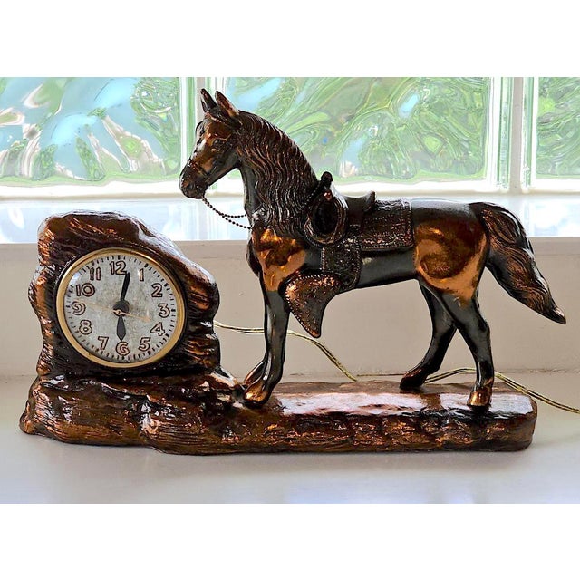 Add a touch of Western elegance and antique charm to your home with this vintage copper horse mantel clock by the renowned...