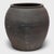 Sculpted during the early 20th century in China's Shanxi province, this clay vessel has a smoky grey exterior with...