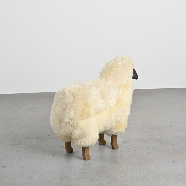 This charming life-size sheep is a handcrafted piece from the 1980s, both decorative and playful. with its solid wood...