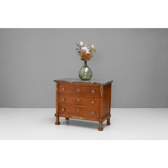 Small sized French " Empire " style mahogany commode with marble top and original brass fittings. Circa 1870.