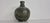 Dark green studio ceramic vase with blue and brown speckles in very good condition.