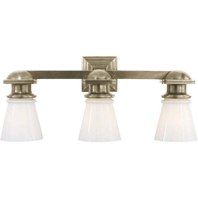 New York Subway Triple Light in Antique Nickel with White Glass Designer: Chapman & Myers Height: 9.75" Extension: 8"...