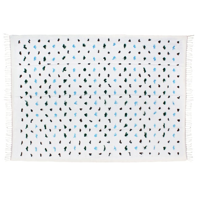 Berber throw handmade in the High Atlas Mountains of Morocco. Featuring colorful pile tufts, creating an intricate...