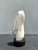 A beautifully carved vintage stone sculpture depicting a stylized pelican in an elegant, minimalist form. The artist...