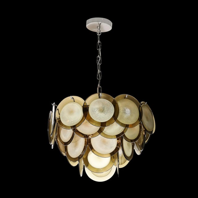 This refined modernist chandelier was realized in Murano, Italy- the island off the coast of Venice renowned for centuries...
