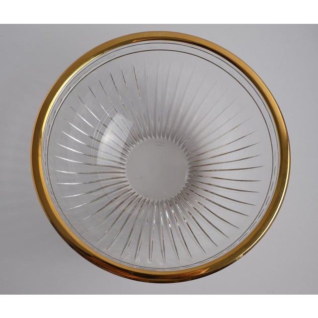 An elegant Marquis by Waterford cut crystal bowl, featuring deep vertical fluting and a refined gilt rim that adds a touch...