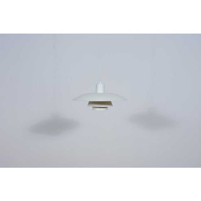 The lamp was designed by Poul Henningsen and produced by Louis Poulsen from 1966 until it was discontinued in this color...