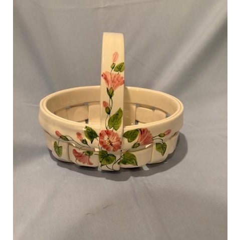 Beautiful handmade/handpainted polished ceramic basket of pink flowers/green leaves on white background For display or use...