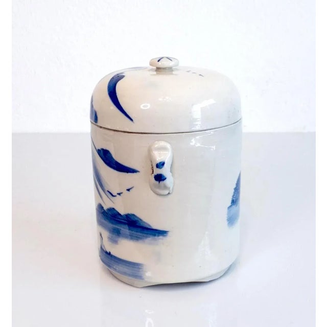 Vintage Chinese Porcelain Blue & White Tea Caddy, cylindrical in form with handles and cover. A continuous wrap-around...