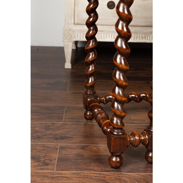 An English barley twist mahogany console table from the mid-19th century, with red marble top. This English barley twist...