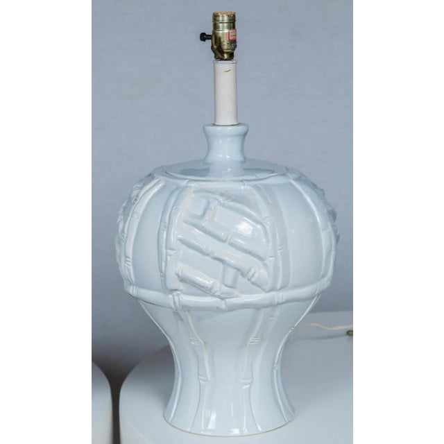 Large scale white ceramic faux bamboo pair of lamps from the 1970s. High relief bamboo motif. Very dramatic lamps.