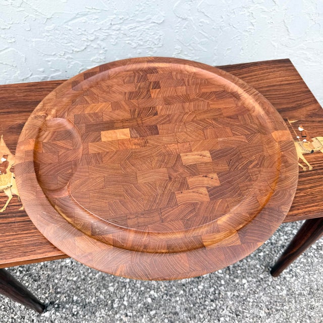 Designed by Jens Harald Quistgaard for Dansk International, this Danish modern round serving tray showcases the warm...