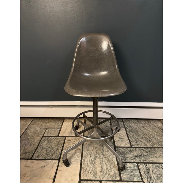 Vintage set of three authentic Herman Miller fiberglass shell chairs designed by Charles and Ray Eames. These feature...